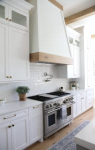 Steiner Transitional White Kitchen With Wood Trimmed Hood - UB Kitchens ...